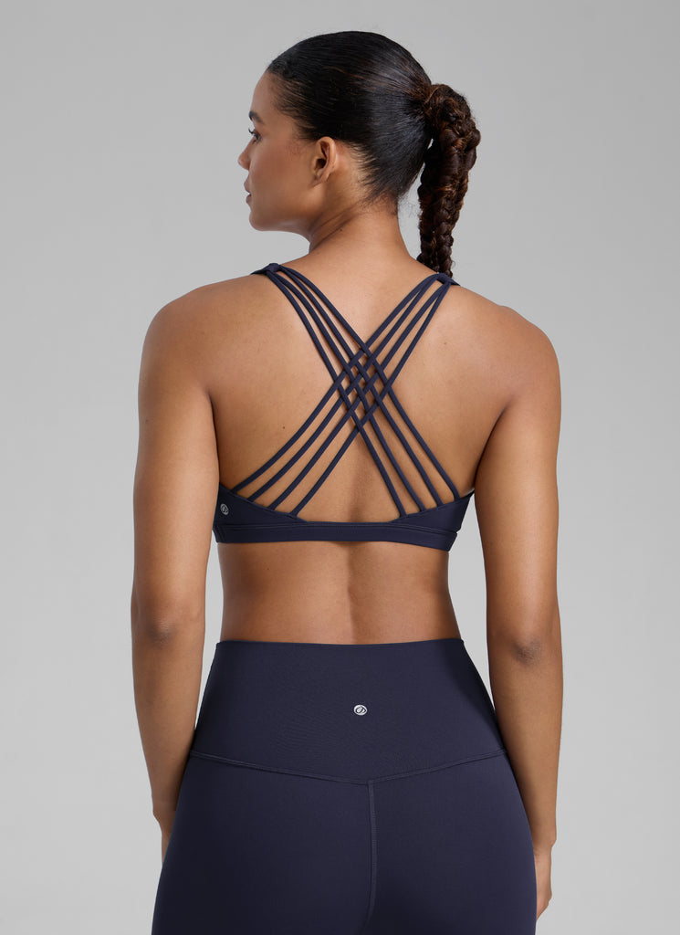 CRZ YOGA Women's Yoga Light Support Nakedfeel Strappy Bra Low Cut Navy