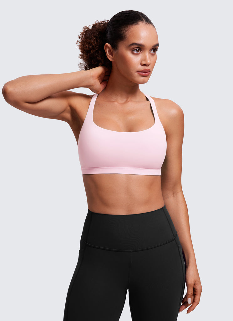 CRZ YOGA Women's Yoga Light Support Nakedfeel Strappy Bra Low Cut Strawberry Pink