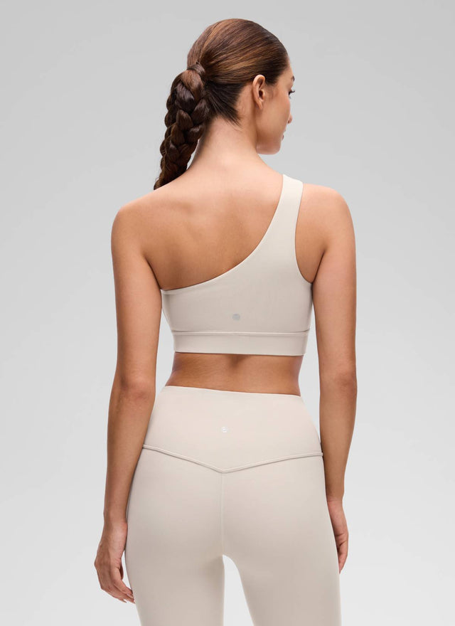 CRZ YOGA Butterluxe Womens One Shoulder Sports Bra Asymmetrical Padded Mojave Tan @model_info:Inga