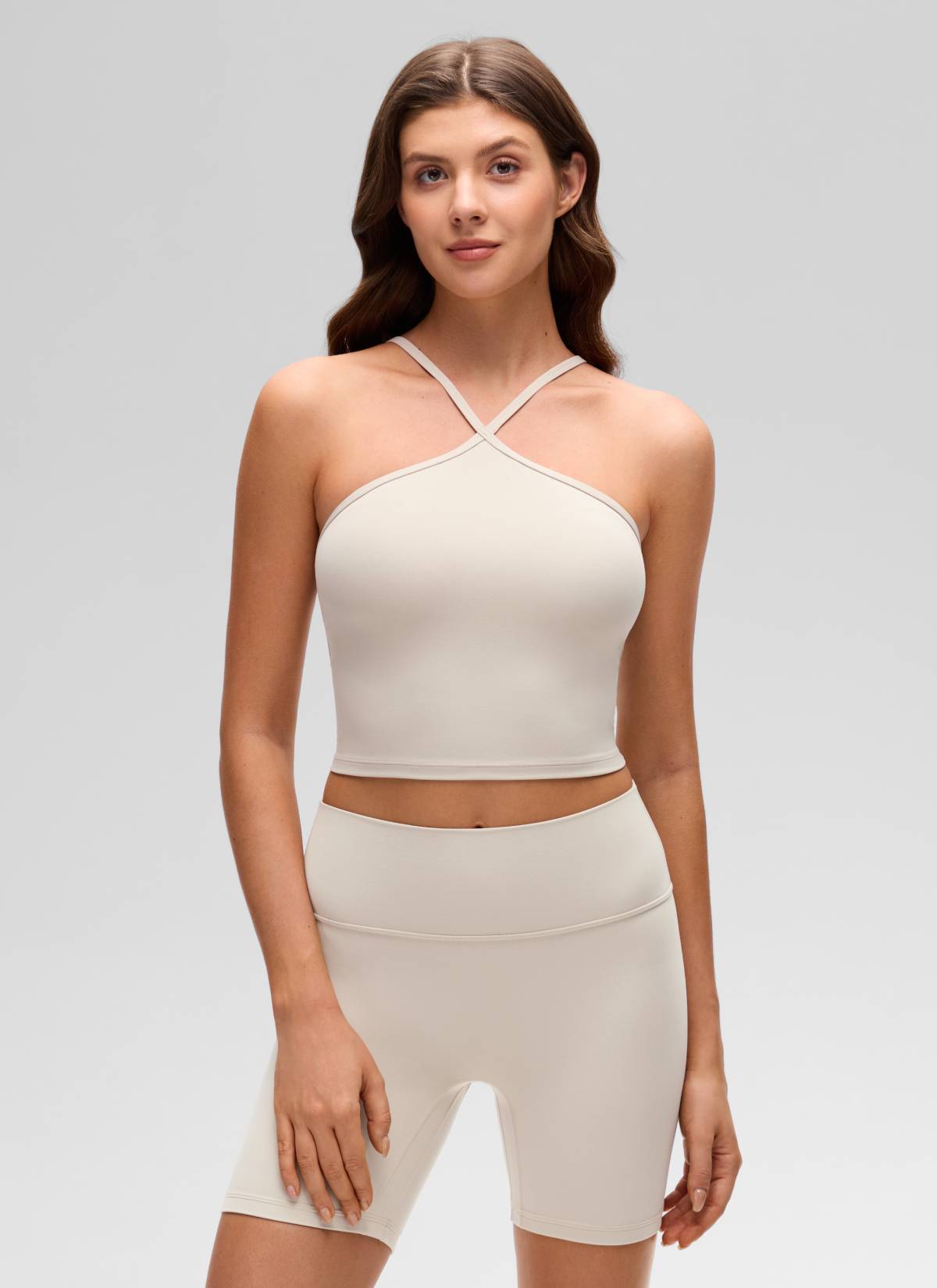 CRZ YOGA Women's Butterluxe Yoga Cross Halter Crop Built in Bra Tank Mojave Tan @model_info:Gelya
