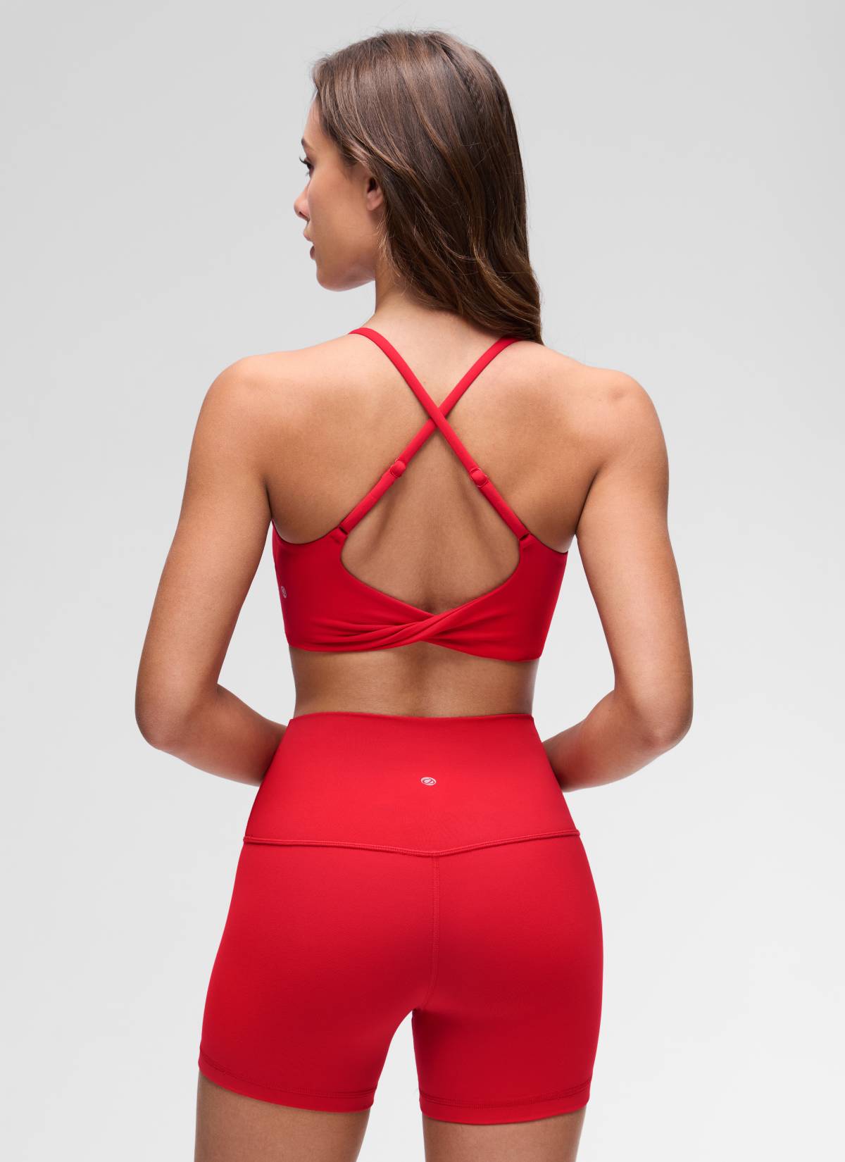 CRZ YOGA Women's Butterluxe Yoga Scoop Neck Twist Cross Back Sport Bra Aurora Red @model_info:Maria