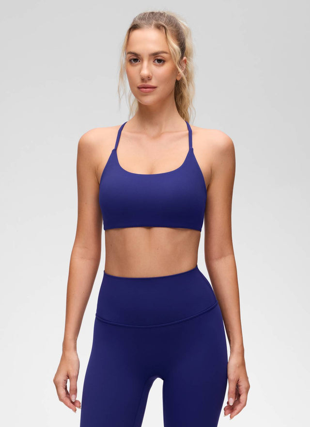 CRZ YOGA Women's Butterluxe Yoga Scoop Neck Twist Cross Back Sport Bra Larkspur Blue @model_info:Anna