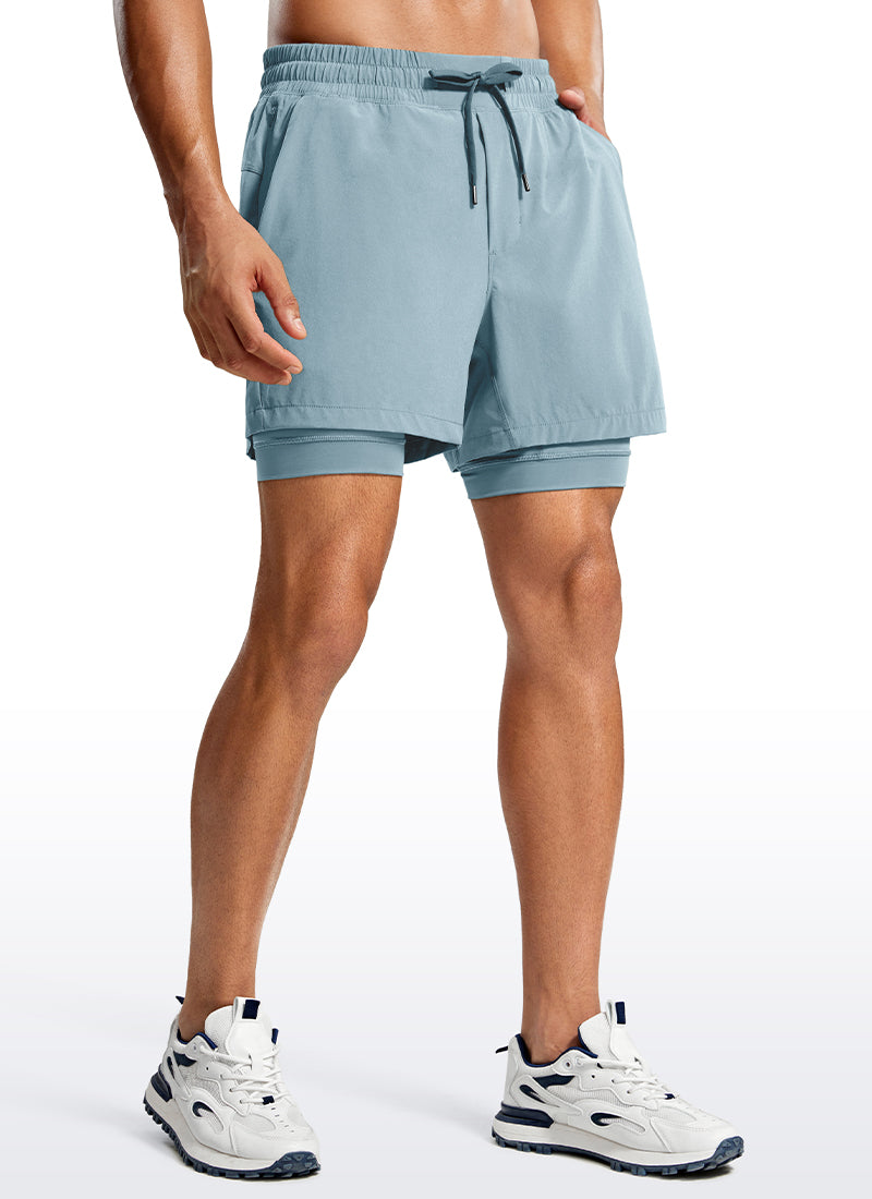 CRZ YOGA Men's Train Relaxed Fit Feathery-Fit 2 in 1 Shorts 5'' with Long Liner Light grayish blue @model_info:Jhony