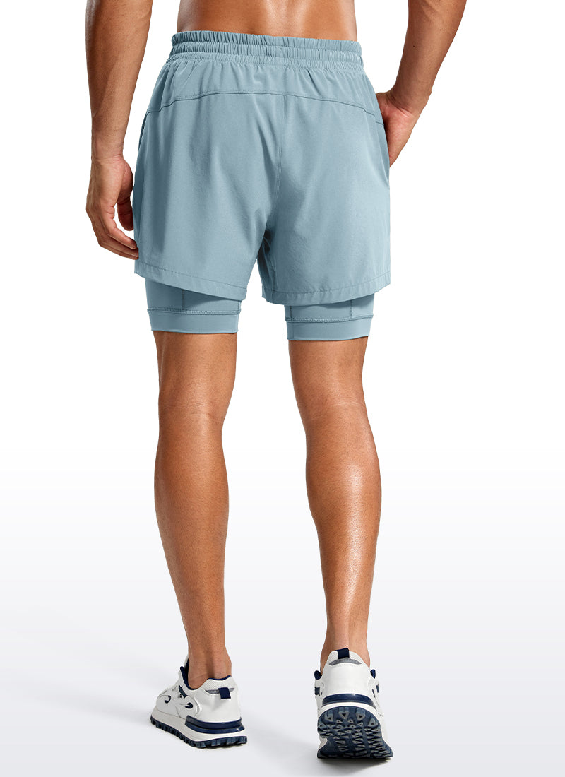 CRZ YOGA Men's Train Relaxed Fit Feathery-Fit 2 in 1 Shorts 5'' with Long Liner Light grayish blue @model_info:Jhony