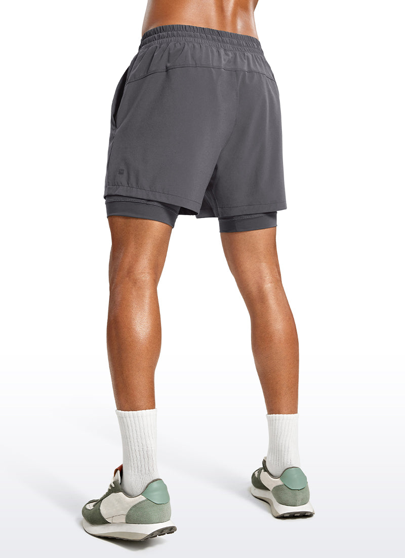 CRZ YOGA Men's Train Relaxed Fit Feathery-Fit 2 in 1 Shorts 5'' with Long Liner Dark Carbon @model_info:Jhony