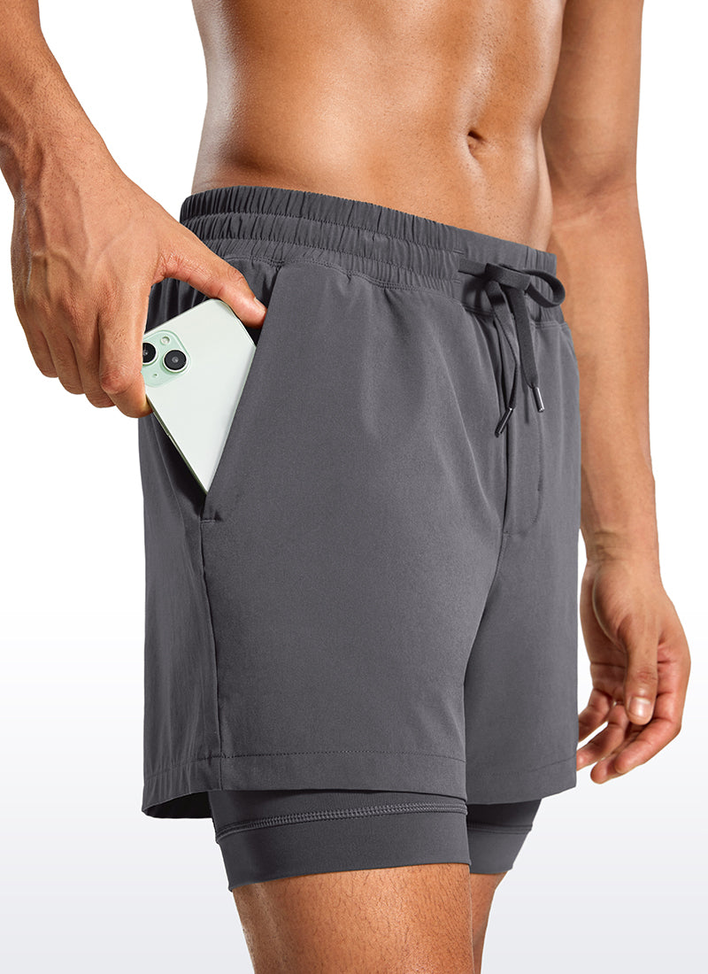 CRZ YOGA Men's Train Relaxed Fit Feathery-Fit 2 in 1 Shorts 5'' with Long Liner Dark Carbon @model_info:Jhony