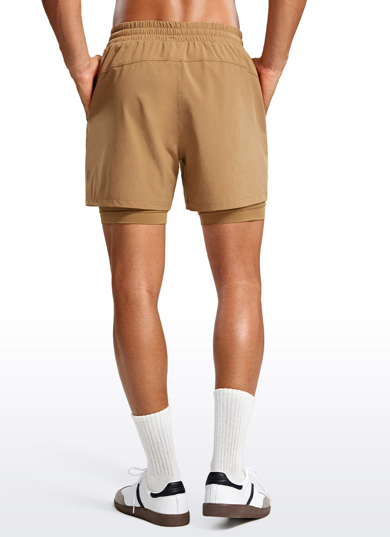 CRZ YOGA Men's Train Relaxed Fit Feathery-Fit 2 in 1 Shorts 5'' with Long Liner Khaki Sand @model_info:Jhony
