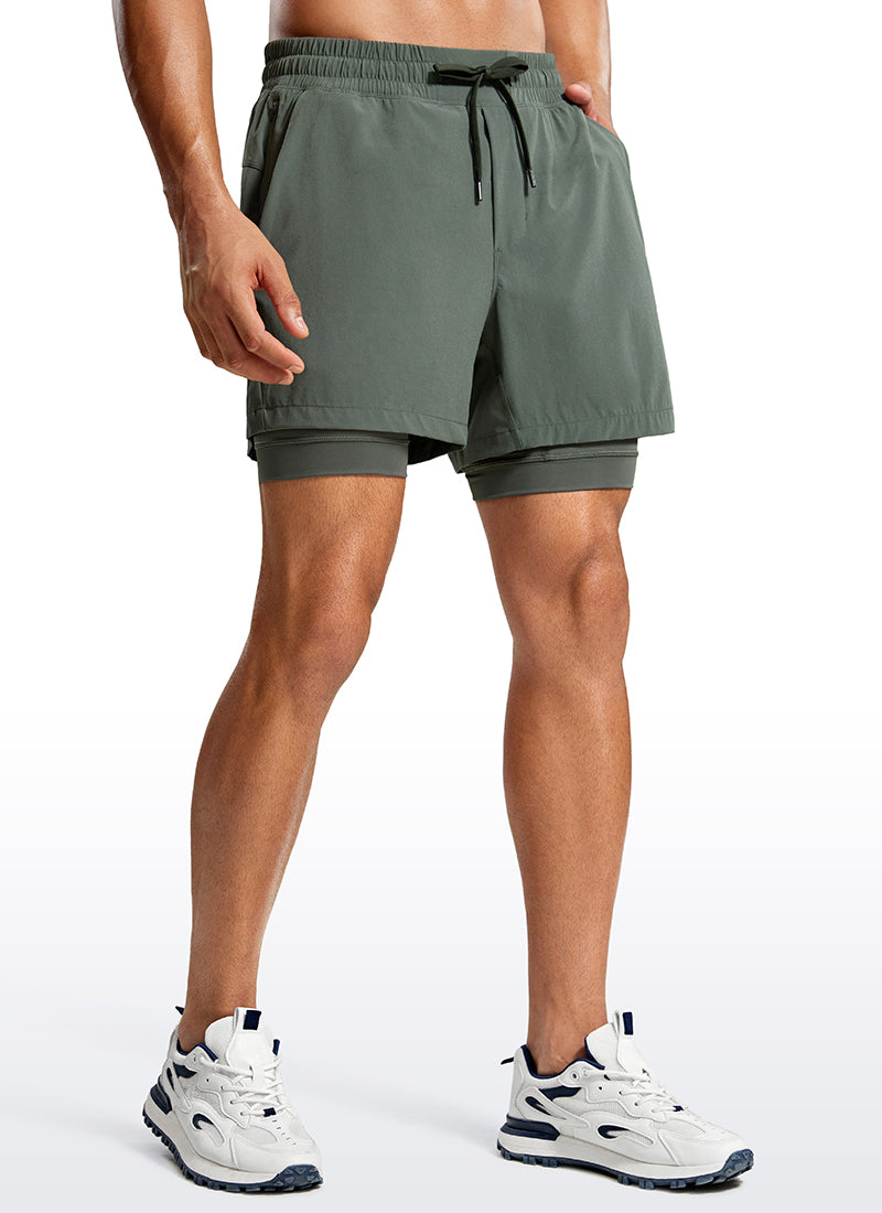 CRZ YOGA Men's Train Relaxed Fit Feathery-Fit 2 in 1 Shorts 5'' with Long Liner Grey Sage @model_info:Jhony
