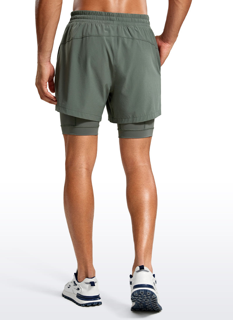 CRZ YOGA Men's Train Relaxed Fit Feathery-Fit 2 in 1 Shorts 5'' with Long Liner Grey Sage @model_info:Jhony