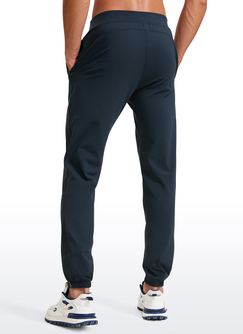 CRZ YOGA Men's Run Slim Fit On the Travel Joggers 30''- Ankle Zipper True Navy