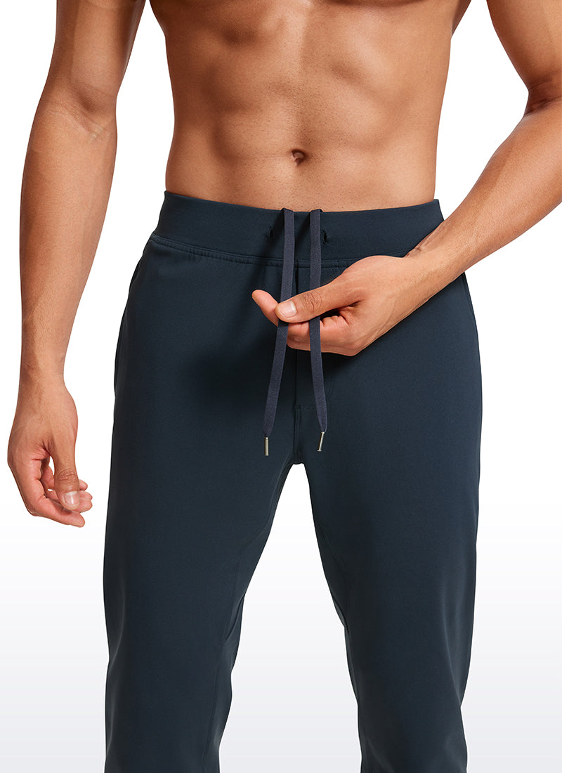 CRZ YOGA Men's Run Slim Fit On the Travel Joggers 30''- Ankle Zipper True Navy @model_info:Jhony