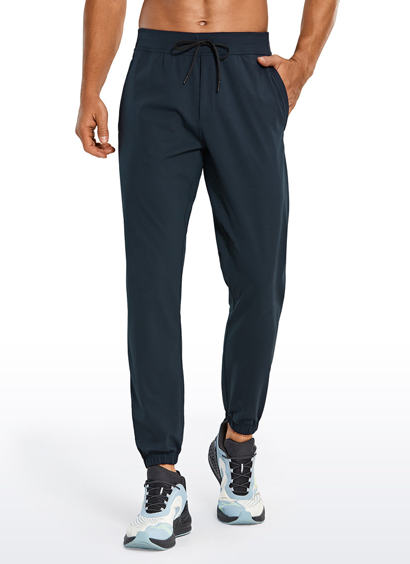 CRZ YOGA Men's Run Slim Fit On the Travel Joggers 28''- Ankle Zipper True Navy