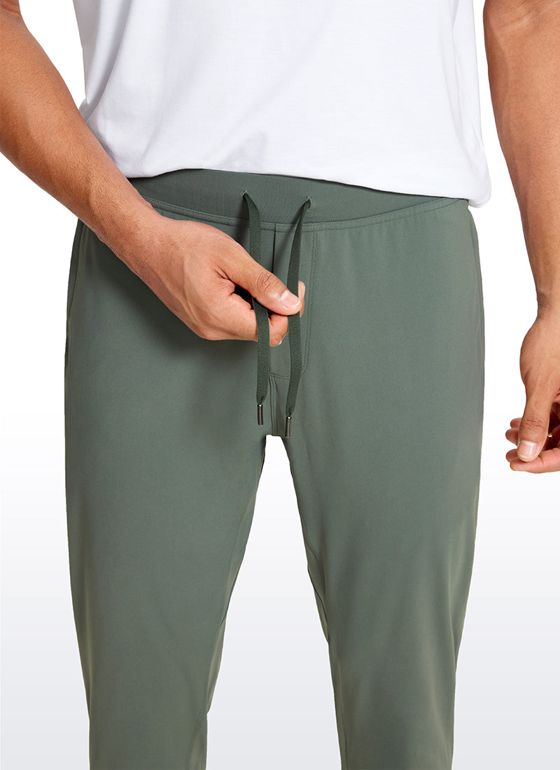 CRZ YOGA Men's Run Slim Fit On the Travel Joggers 28''- Ankle Zipper Grey Sage @model_info:Jhony