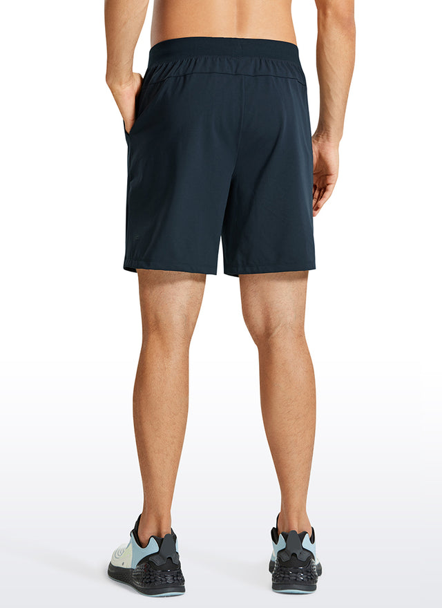 CRZ YOGA Men's Train Relaxed Fit On the Travel Linerless Shorts 7'' True Navy @model_info:M