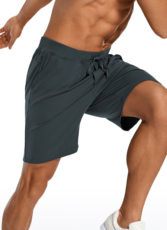 CRZ YOGA Men's Train Relaxed Fit On the Travel Linerless Shorts 7'' Melanite @model_info:A