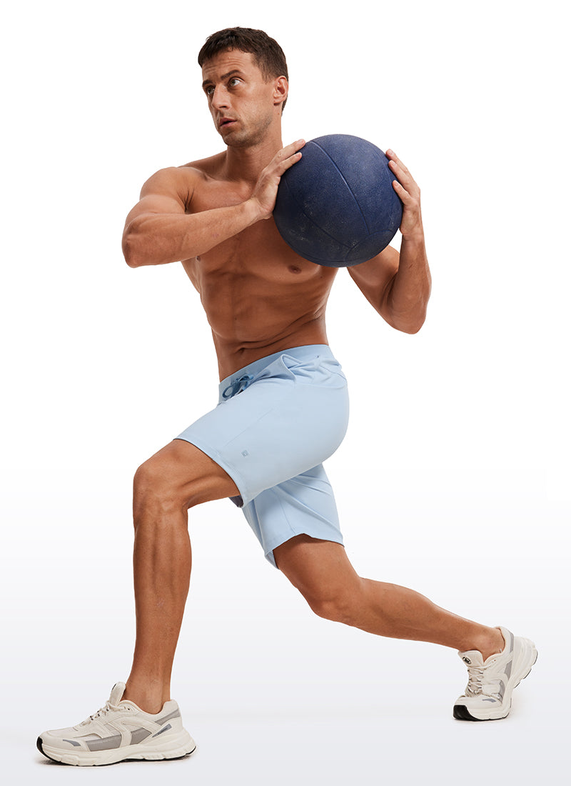 CRZ YOGA Men's Train Relaxed Fit On the Travel Linerless Shorts 7'' Chambray Blue @model_info:ALE