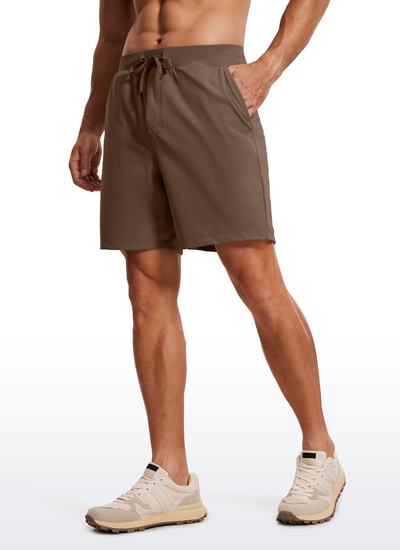 CRZ YOGA Men's Train Relaxed Fit On the Travel Linerless Shorts 7'' Dark Olive Brown @model_info:ALE