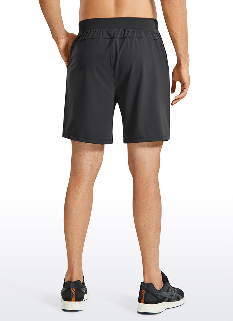 CRZ YOGA Men's Train Relaxed Fit On the Travel Linerless Shorts 7'' Ink Gray @model_info:M