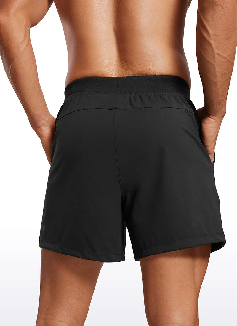 CRZ YOGA Men's Train Relaxed Fit On the Travel Linerless Shorts 5'' Black @model_info:Mazi