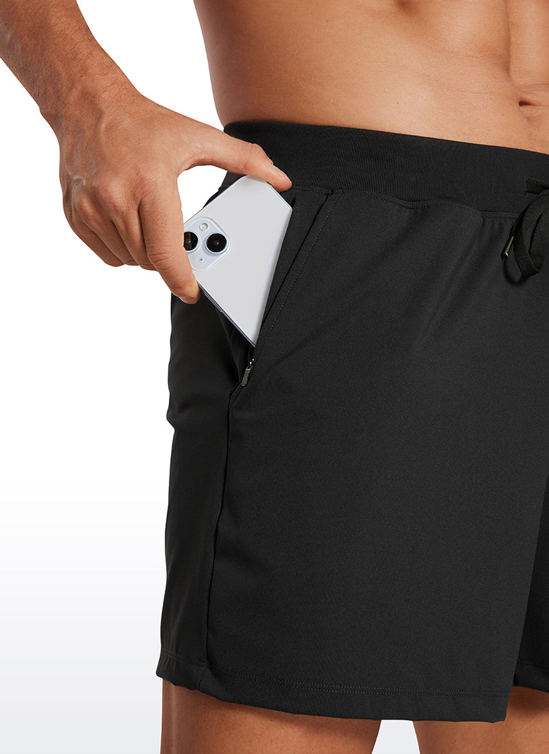 CRZ YOGA Men's Train Relaxed Fit On the Travel Linerless Shorts 5'' Black @model_info:Mazi