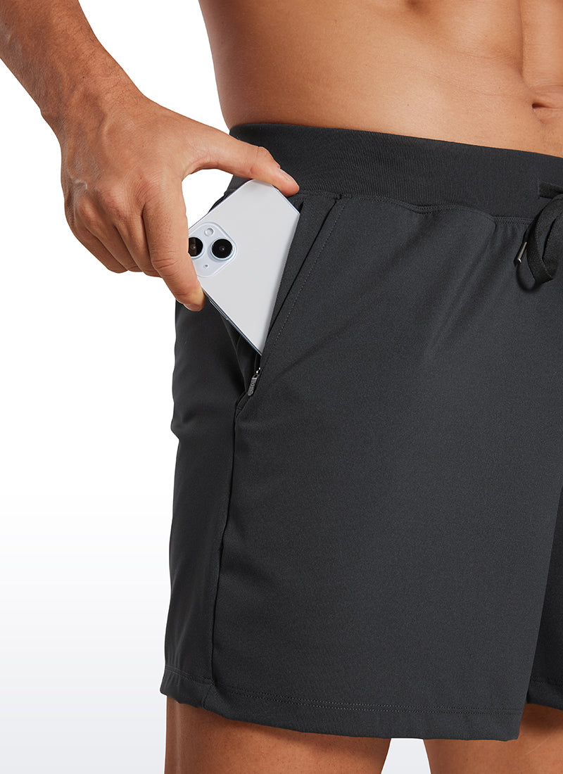 CRZ YOGA Men's Train Relaxed Fit On the Travel Linerless Shorts 5'' Ink Gray @model_info:Mazi