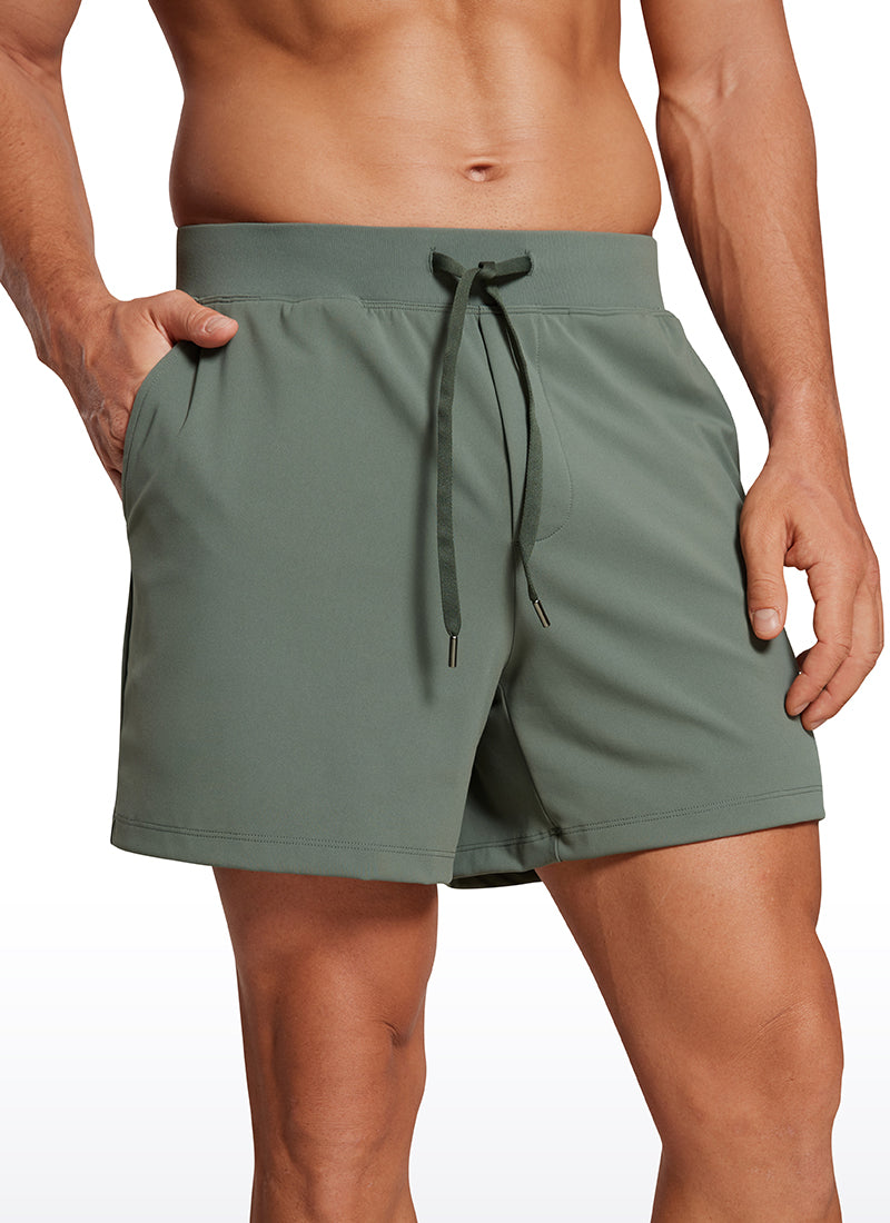 CRZ YOGA Men's Train Relaxed Fit On the Travel Linerless Shorts 5'' Grey Sage @model_info:Mazi