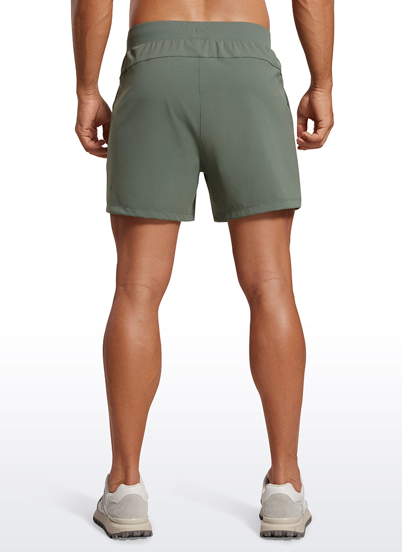 CRZ YOGA Men's Train Relaxed Fit On the Travel Linerless Shorts 5'' Grey Sage @model_info:Mazi