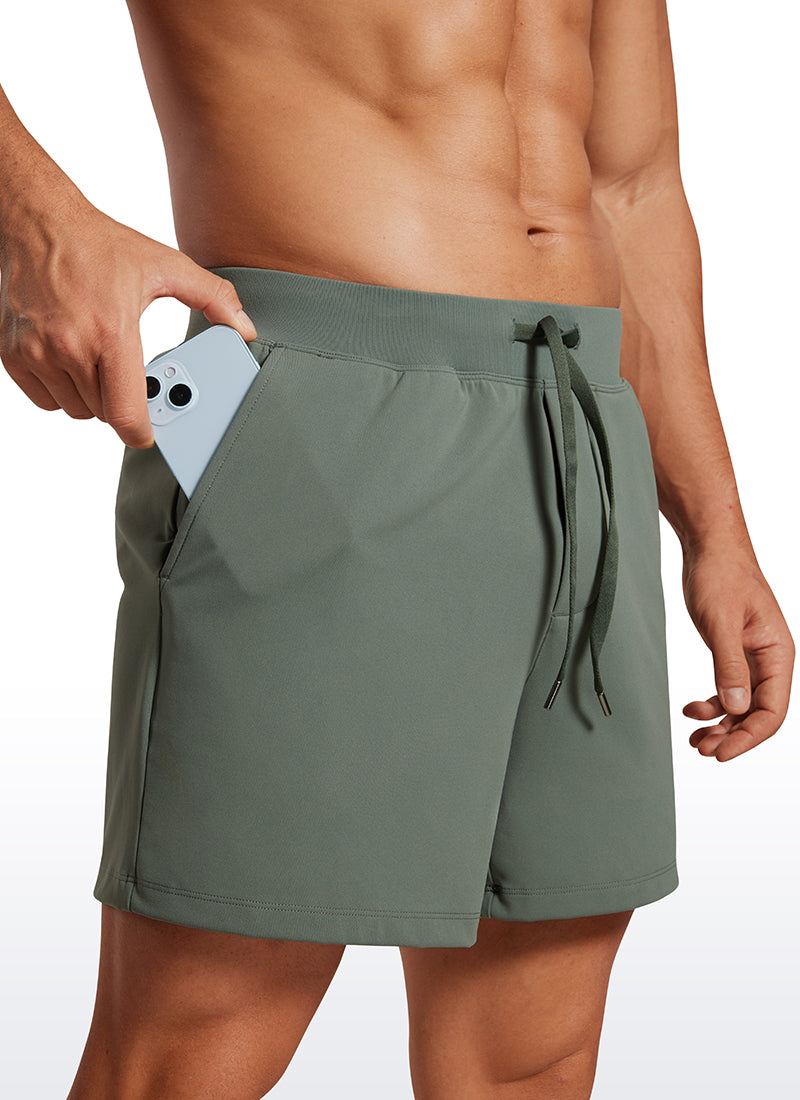 CRZ YOGA Men's Train Relaxed Fit On the Travel Linerless Shorts 5'' Grey Sage @model_info:Mazi