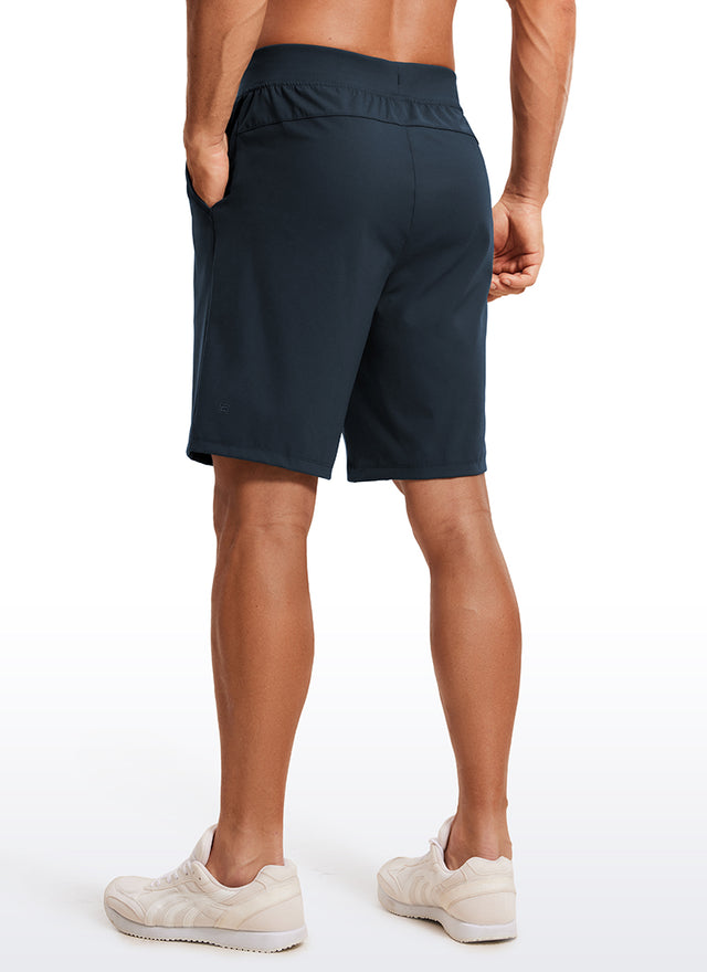 CRZ YOGA Men's Train Relaxed Fit On the Travel Linerless Shorts 9'' True Navy