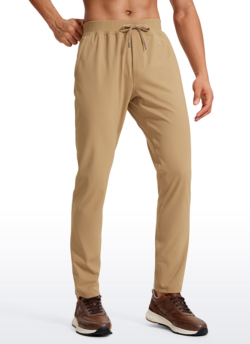 CRZ YOGA Men's Train Relaxed Fit On the Travel Pants 30'' Khaki Sand @model_info:Jhony