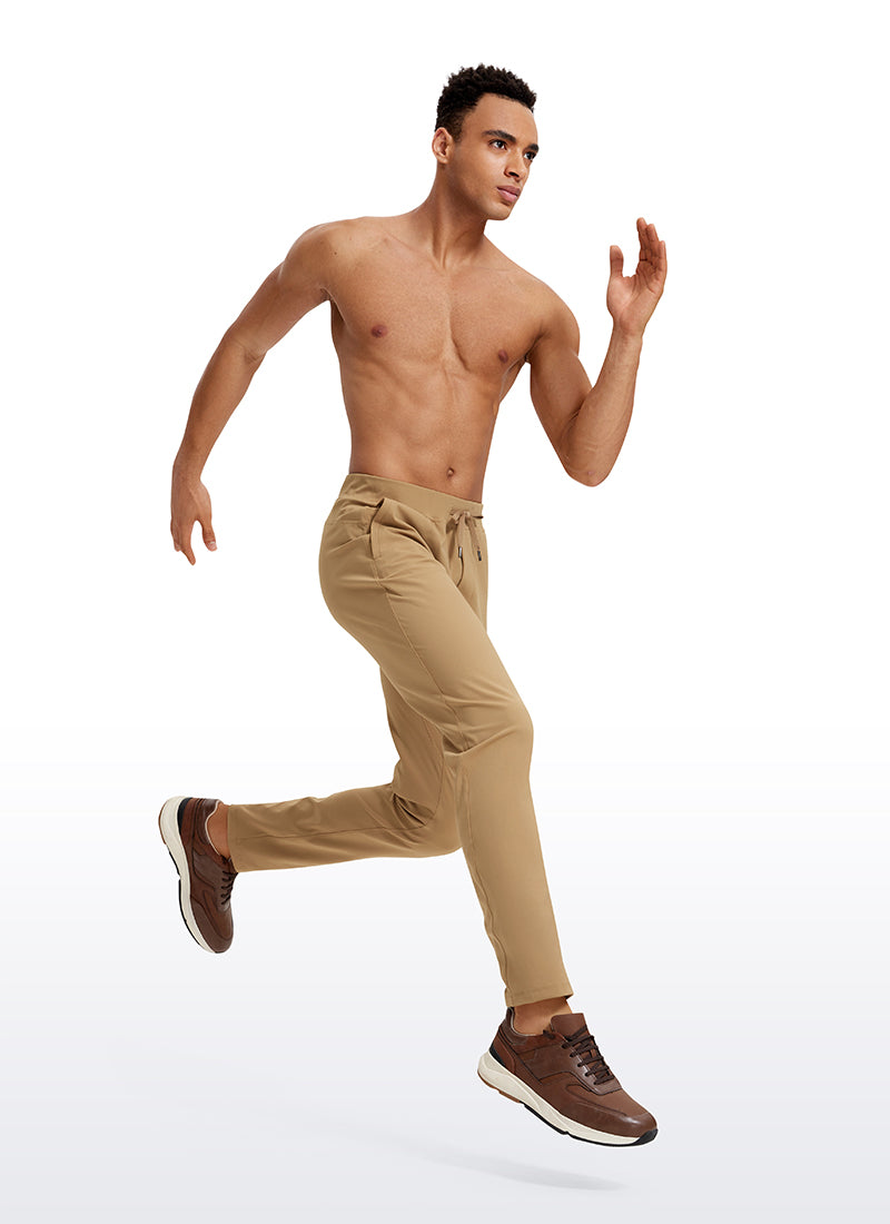 CRZ YOGA Men's Train Relaxed Fit On the Travel Pants 30'' Khaki Sand @model_info:Jhony