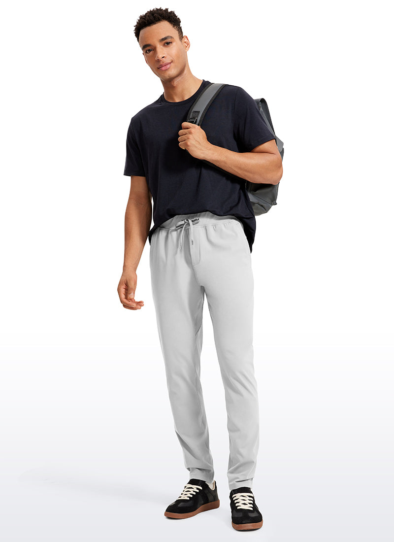 CRZ YOGA Men's Train Relaxed Fit On the Travel Pants 30'' Platinum Grey @model_info:Jhony