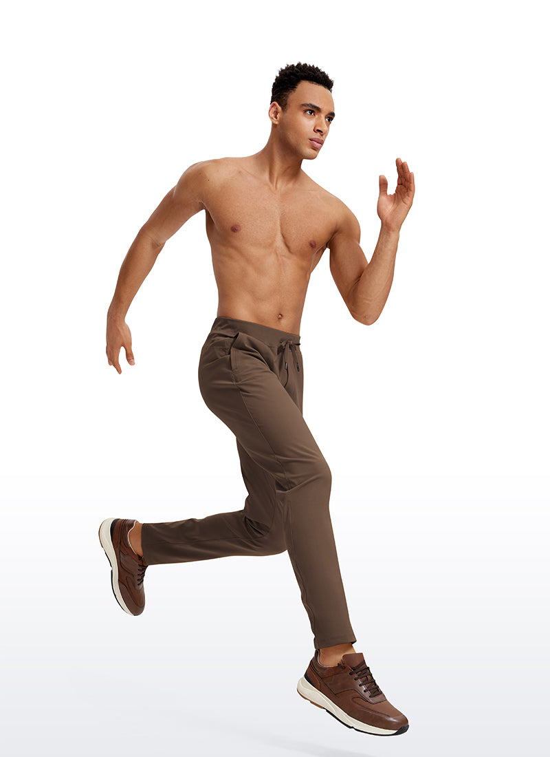 CRZ YOGA Men's Train Relaxed Fit On the Travel Pants 30'' Dark Olive Brown @model_info:Jhony