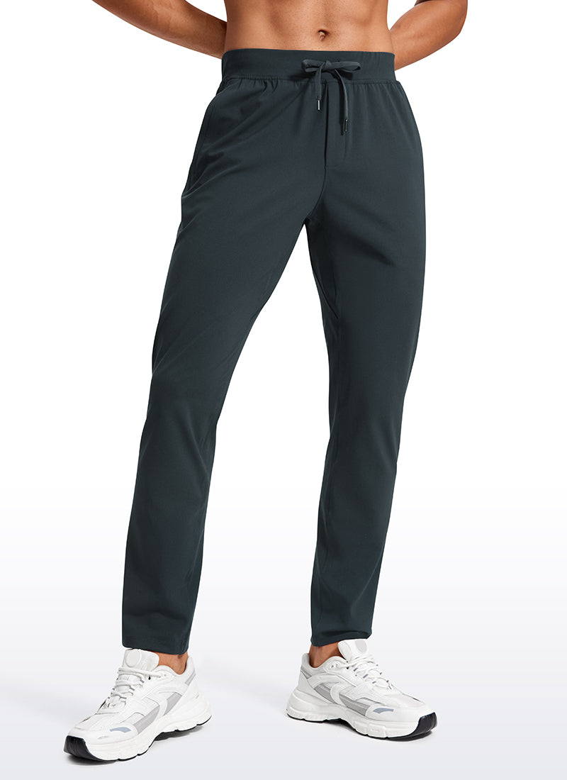 CRZ YOGA Men's Train Relaxed Fit On the Travel Pants 30'' Melanite @model_info:Jhony