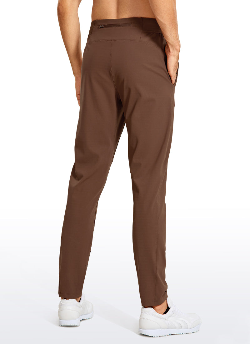 CRZ YOGA Men's Train Relaxed Fit On the Travel Pants 30'' Dark Brown @model_info:M