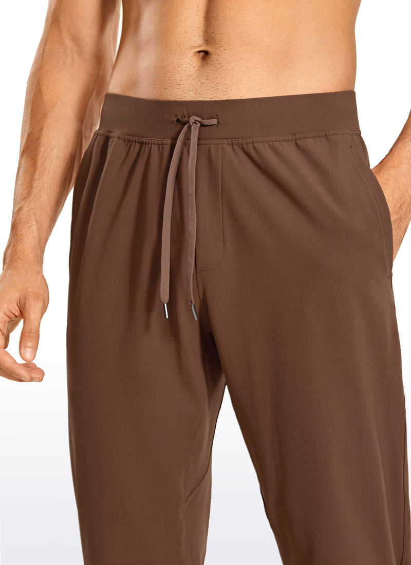 CRZ YOGA Men's Train Relaxed Fit On the Travel Pants 30'' Dark Brown @model_info:M