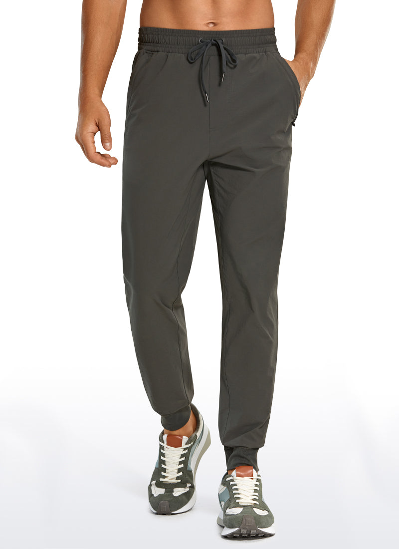CRZ YOGA Men's Causul Relaxed Fit Lightweight Joggers Zip Pockets 29'' Arbor Olive @model_info:A
