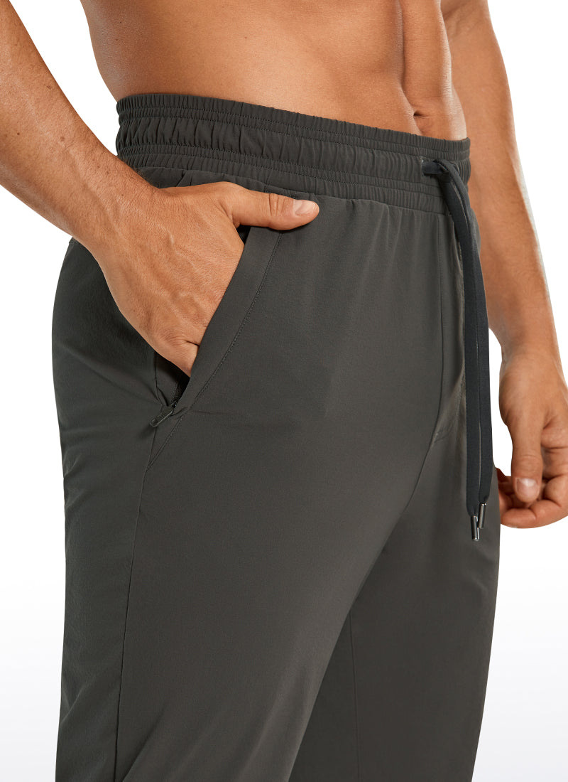 CRZ YOGA Men's Causul Relaxed Fit Lightweight Joggers Zip Pockets 29'' Arbor Olive @model_info:A