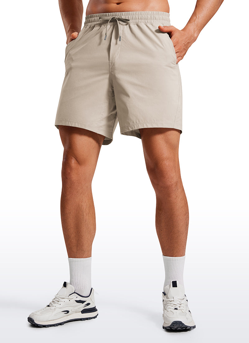 CRZ YOGA Men's Training Quick Dry Pocketed Linerless Shorts 7'' Mojave Tan