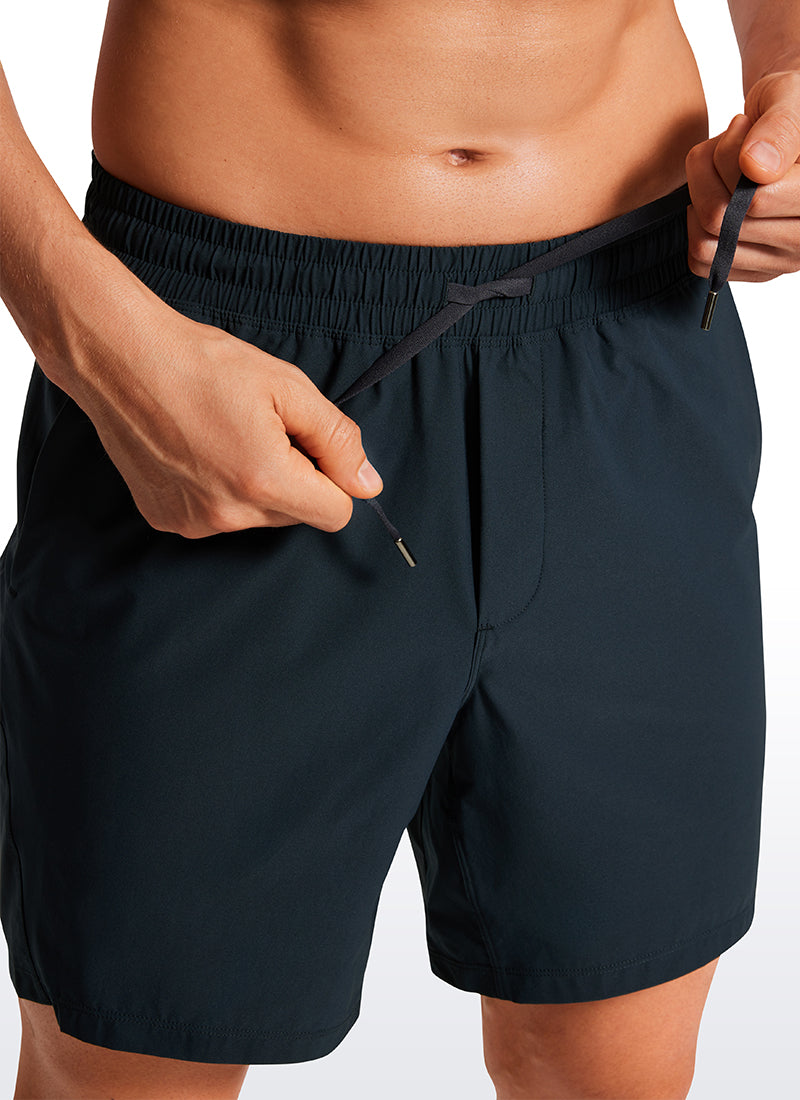 CRZ YOGA Men's Training Quick Dry Pocketed Linerless Shorts 7'' True Navy