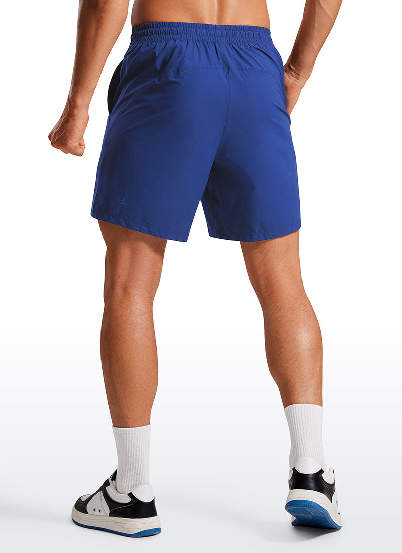 CRZ YOGA Men's Training Quick Dry Pocketed Linerless Shorts 7'' Larkspur Blue