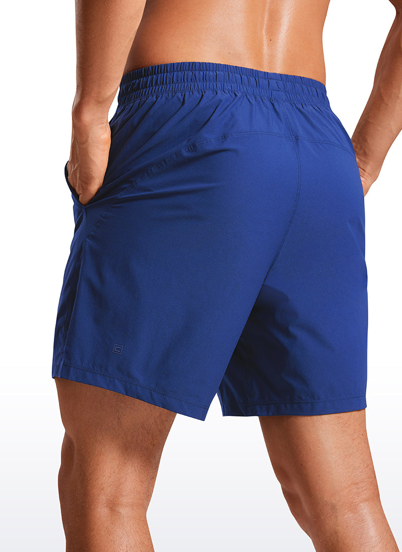 CRZ YOGA Men's Training Quick Dry Pocketed Linerless Shorts 7'' Larkspur Blue