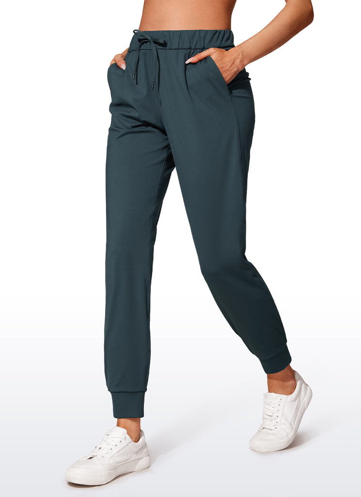 CRZ YOGA Women's Travel Slim Fit Stretch Drawstring Jogger 27'' Forest Dark Green