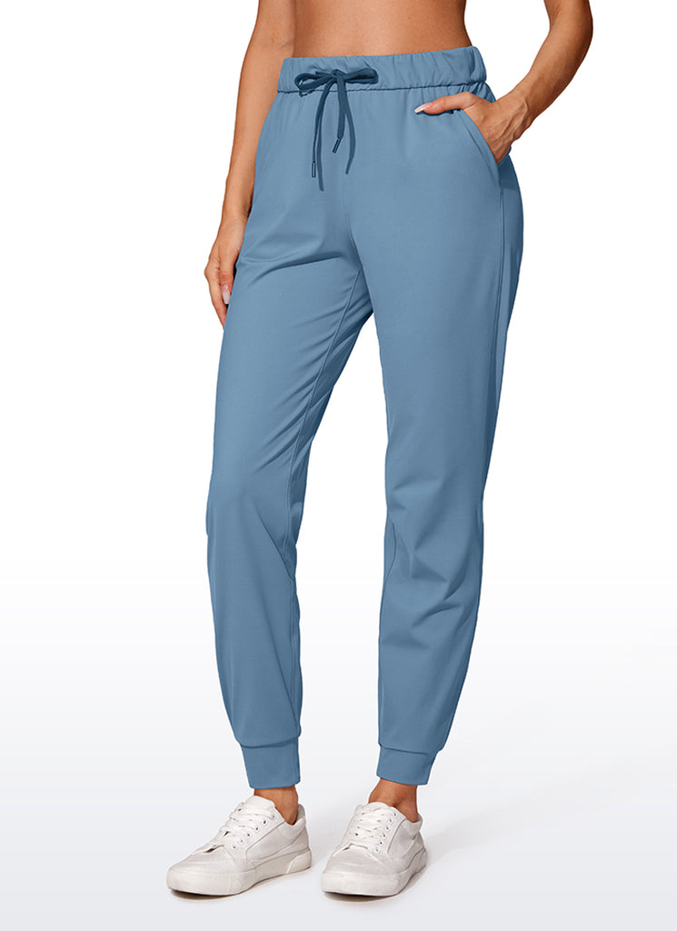 CRZ YOGA Women's Travel Slim Fit Stretch Drawstring Jogger 27'' Forest Dark Green