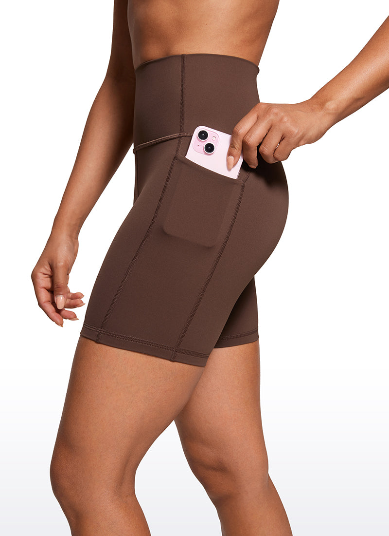 CRZ YOGA Women's Train High Rise Biker Nakedfeel Pocket Shorts 6'' Coffee Brown @model_info:Amanda