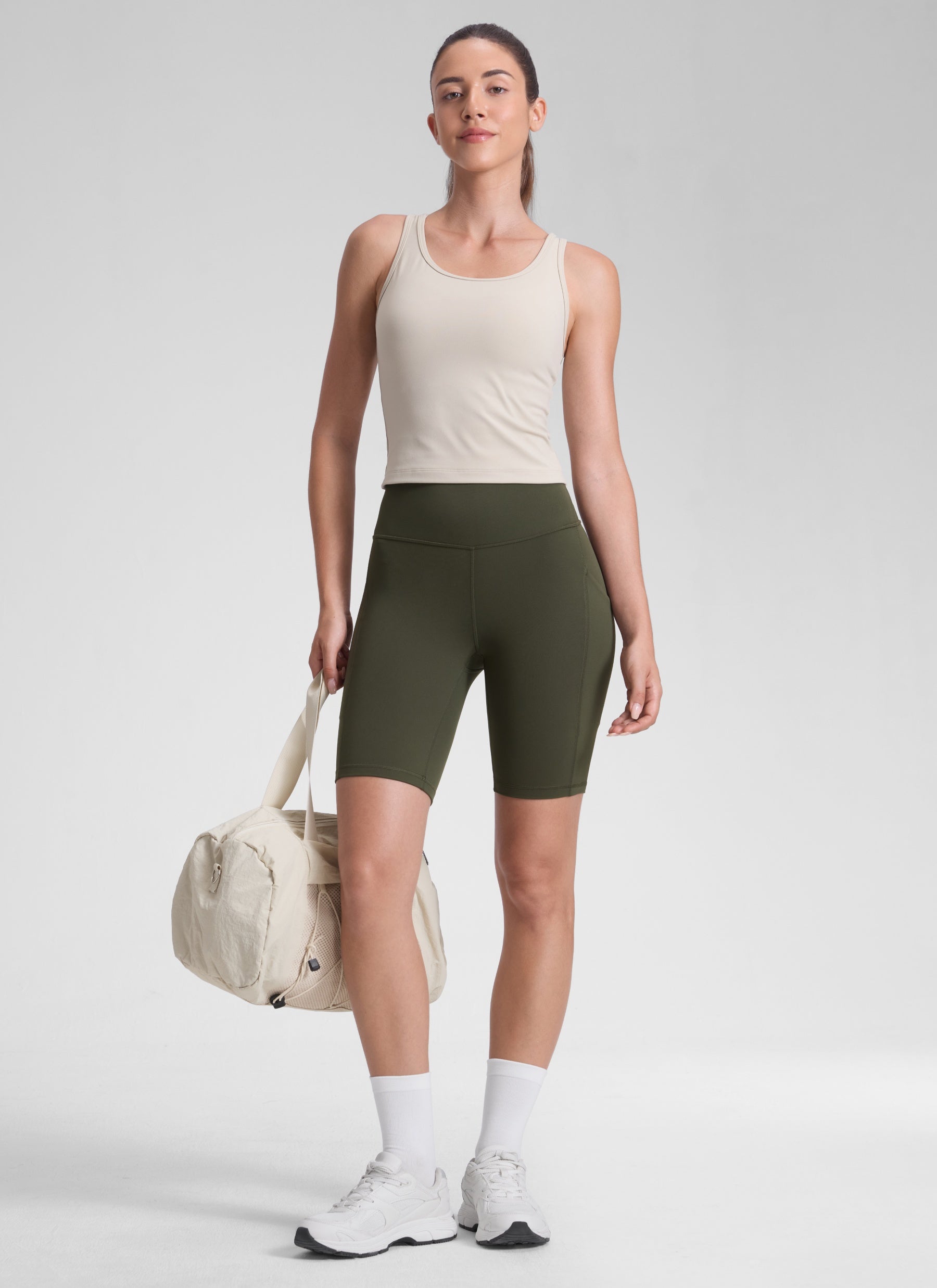 CRZ YOGA Women's Yoga High Rise Biker Butterluxe Pockets Shorts 8'' Olive Green @model_info:Malisa