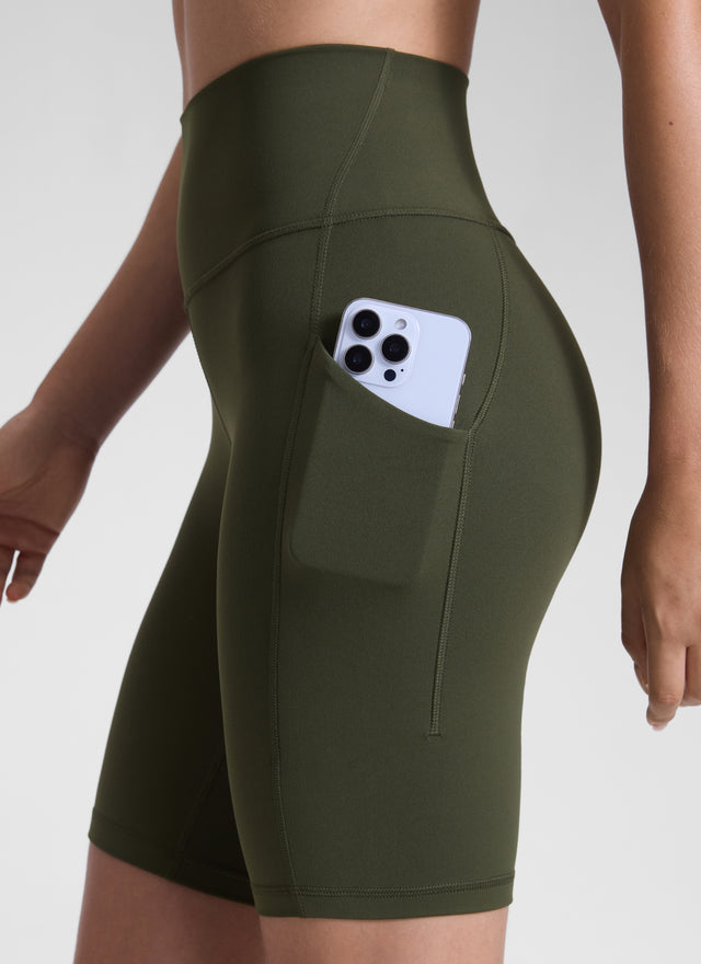 CRZ YOGA Women's Yoga High Rise Biker Butterluxe Pockets Shorts 8'' Olive Green @model_info:Malisa