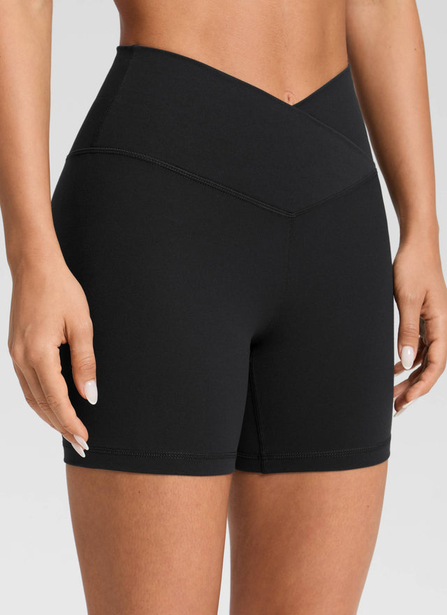CRZ YOGA Women's High Rise Butterluxe V Cross Waist Biker Shorts 5'' Black @model_info:Isidora