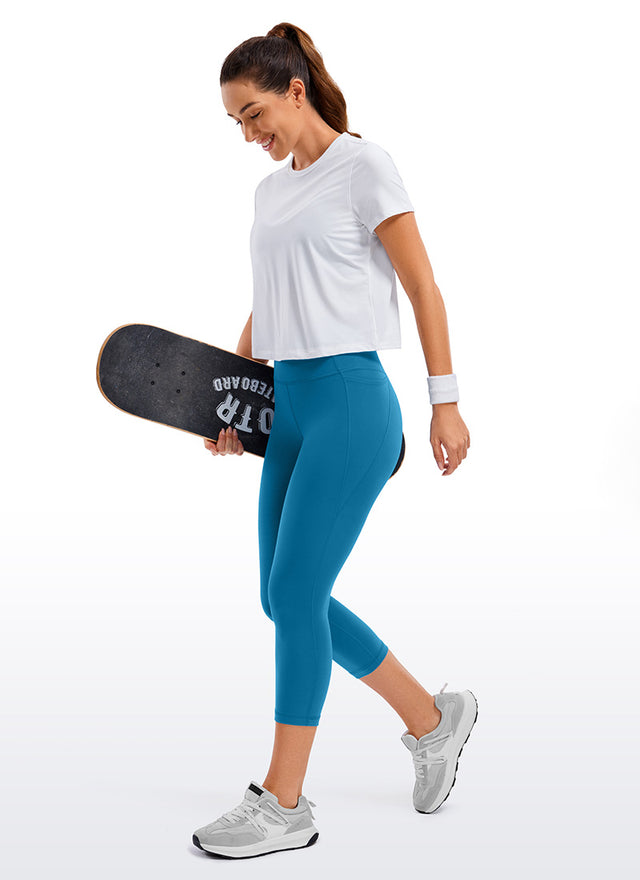 CRZ YOGA Women's Yoga High Rise Butterluxe Capri with Pockets 21'' Super-sonic Blue @model_info:Deni
