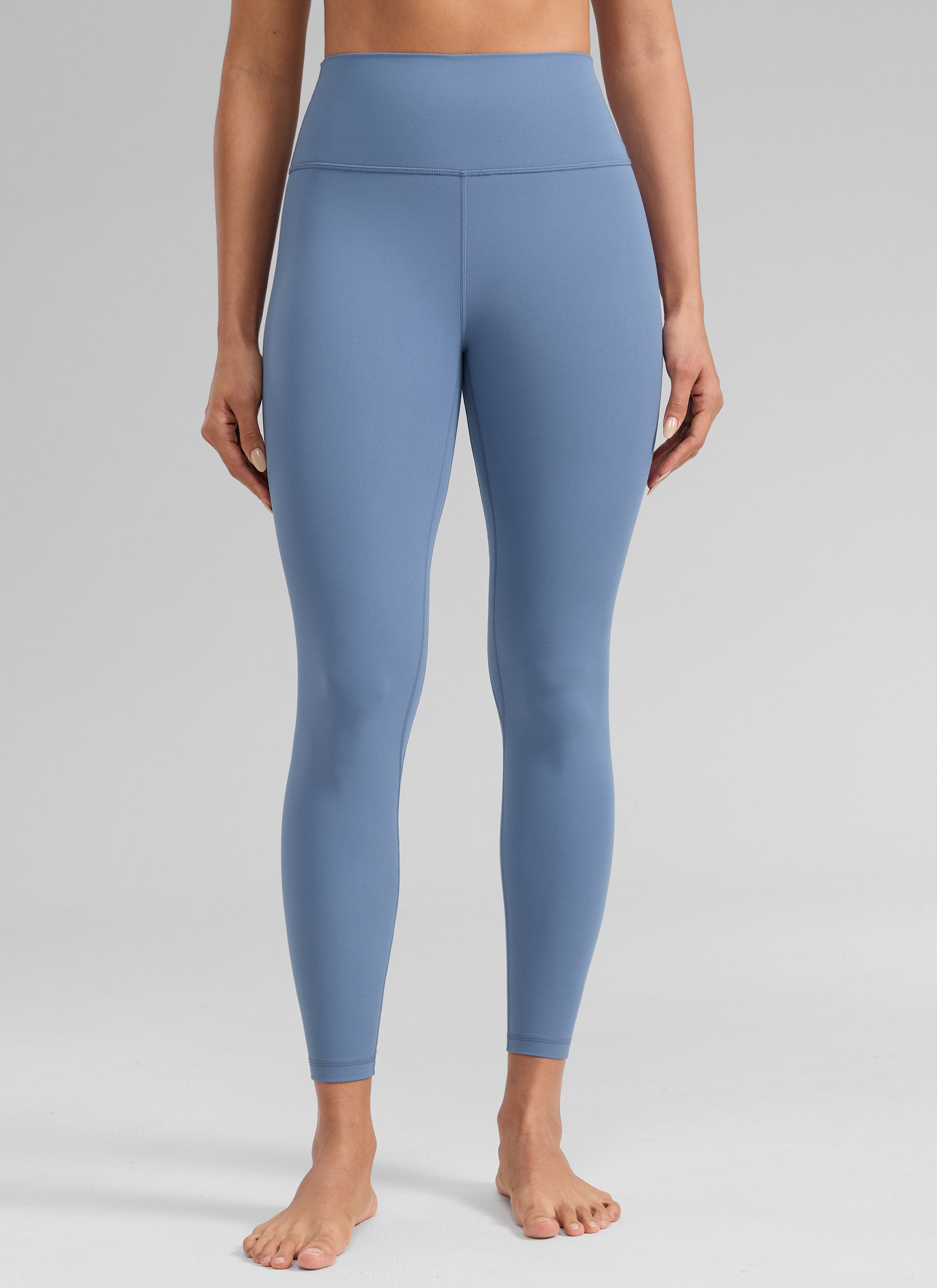 CRZ YOGA Women's Workout High Rise Butterlift Yoga Leggings 25'' Washed Denim @model_info:Dany